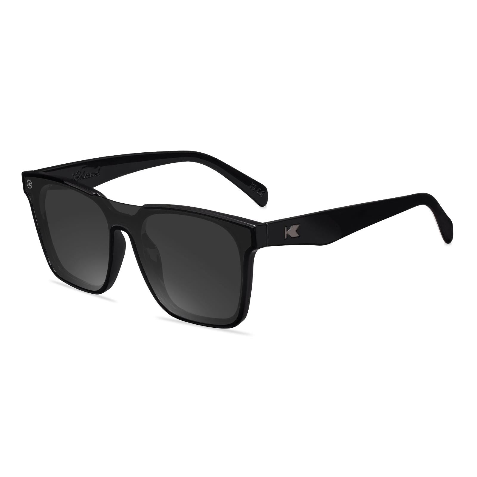 Sunglasses with a black frame with polarized black lenses, flyover