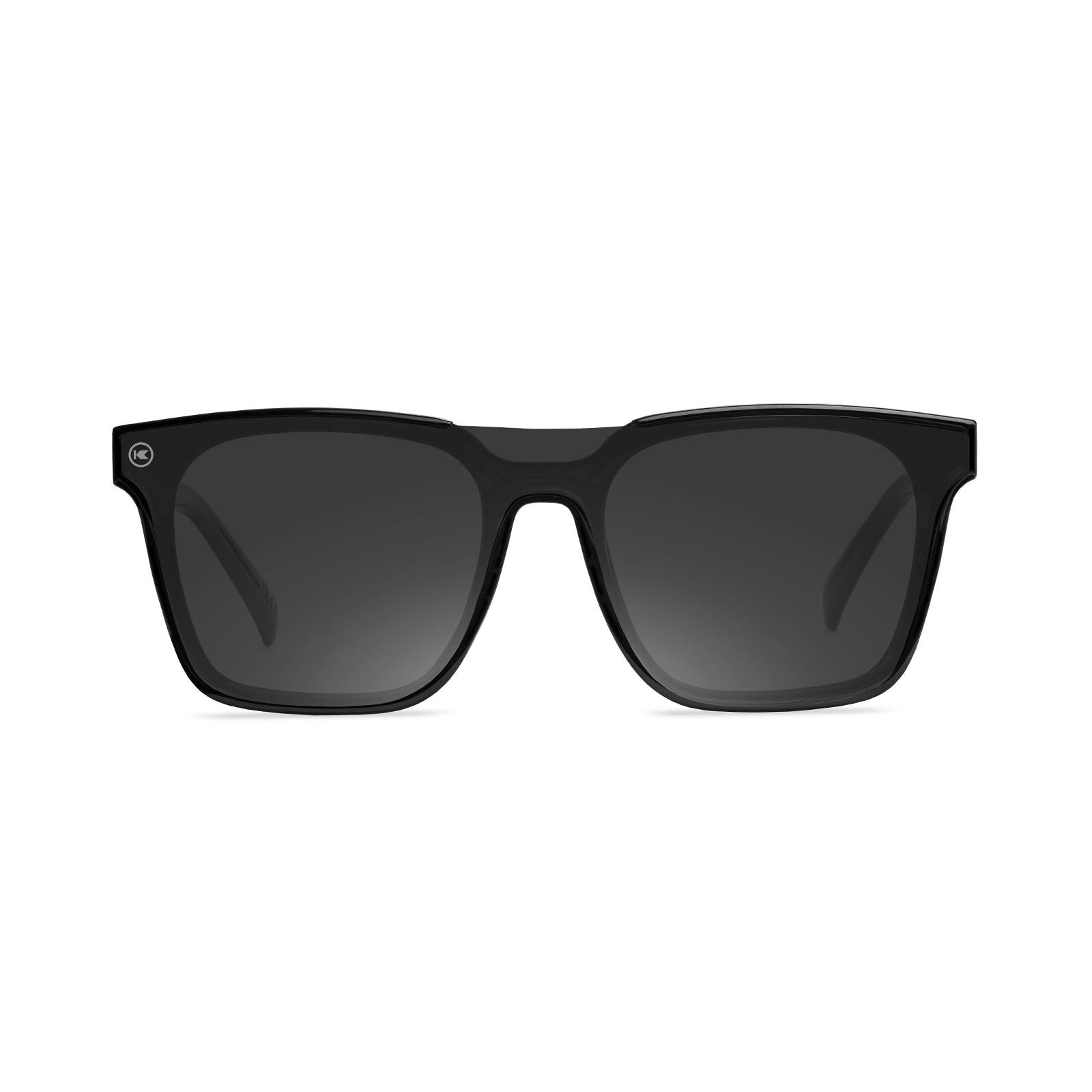Sunglasses with a black frame with polarized black lenses, front