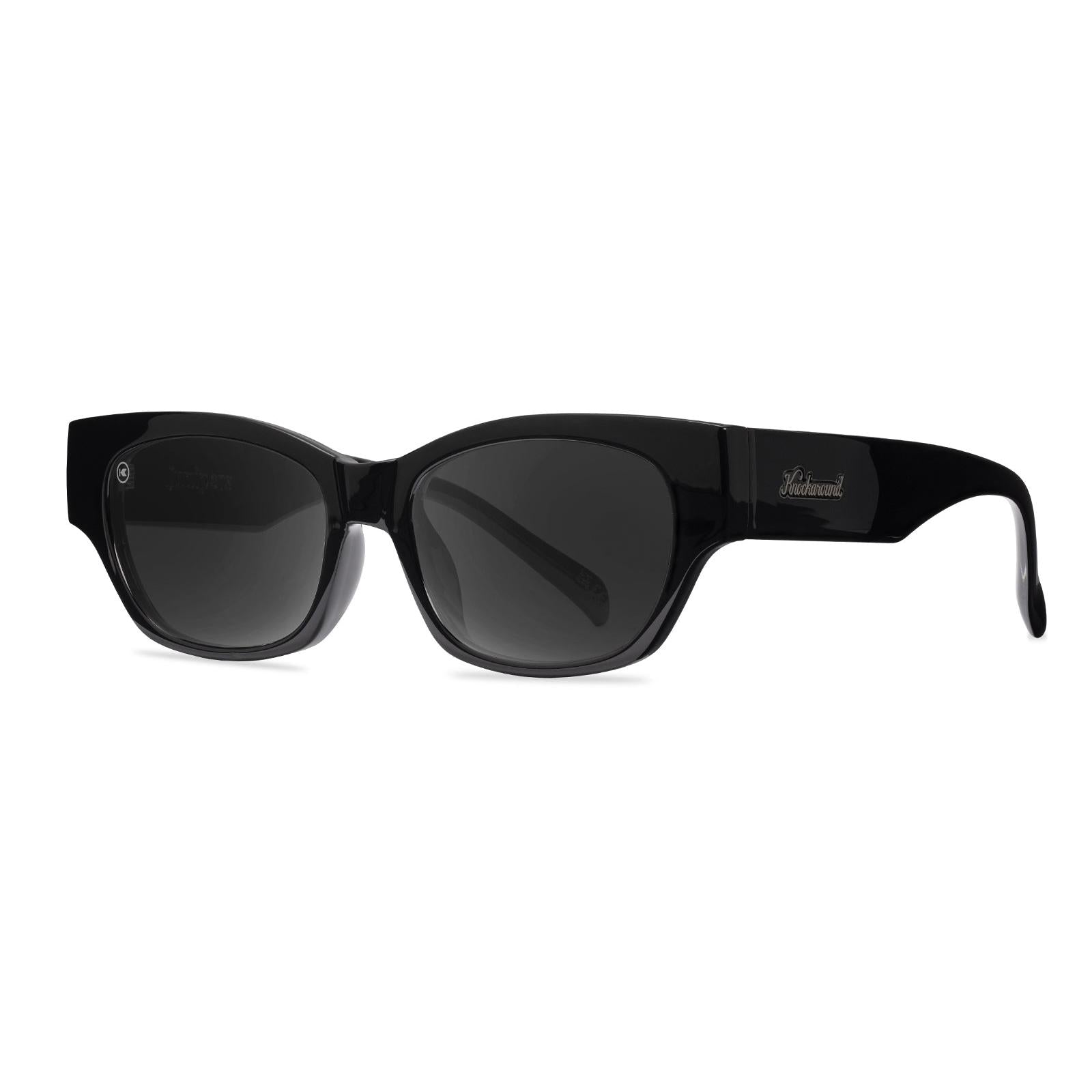 Sunglasses with a glossy black frame and polarized smoke lenses, Threequarter
