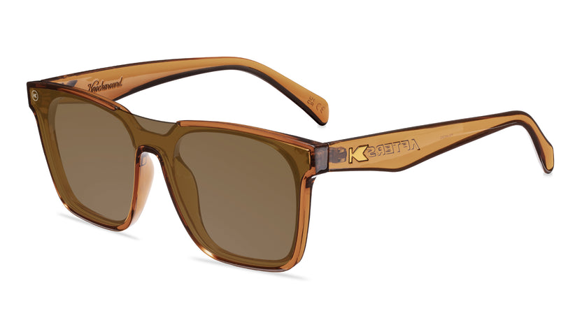 Sunglasses with an amber frame with polarized amber lenses, flyover