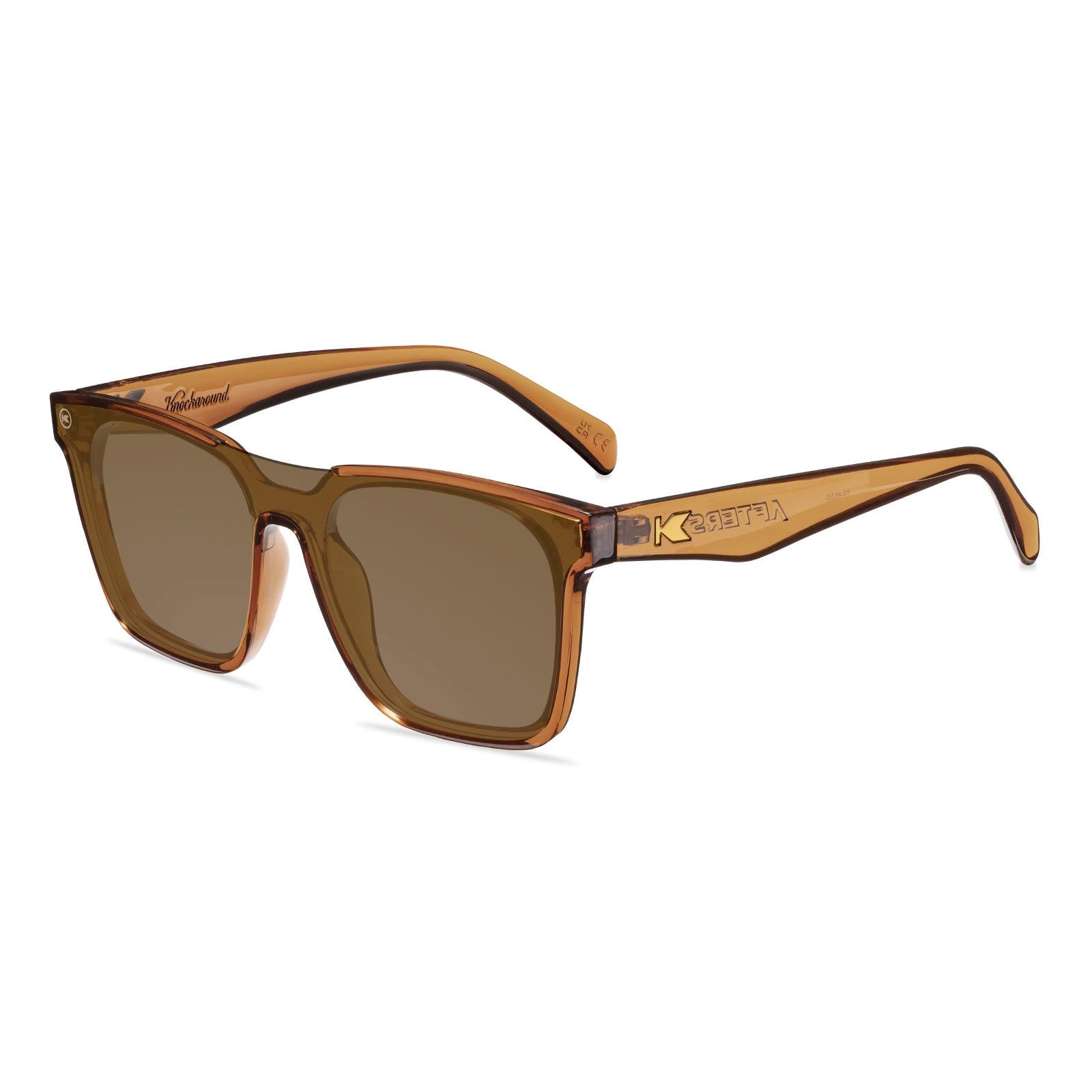 Sunglasses with an amber frame with polarized amber lenses, flyover