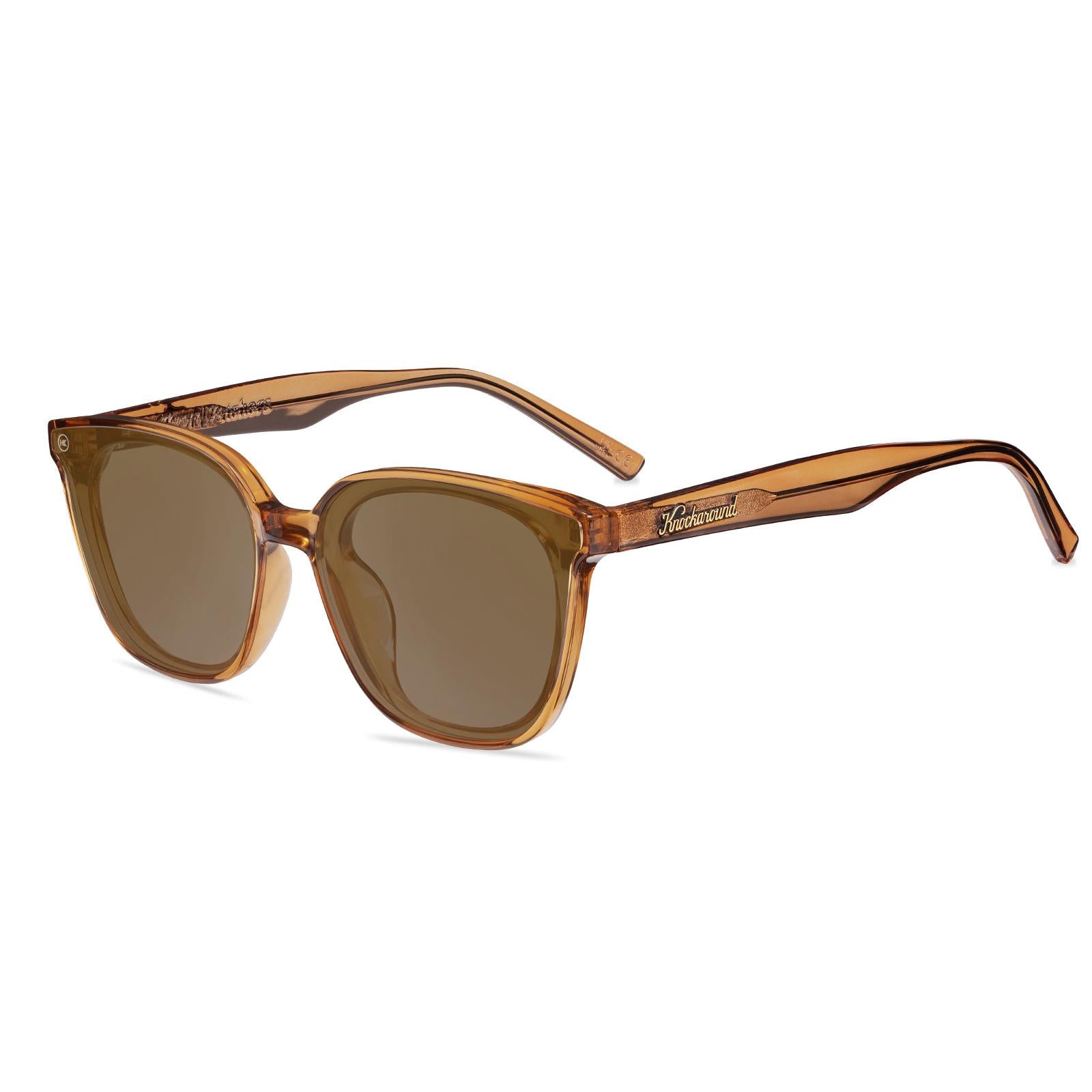 Sunglasses with a amber frame with polarized amber lenses, flyover