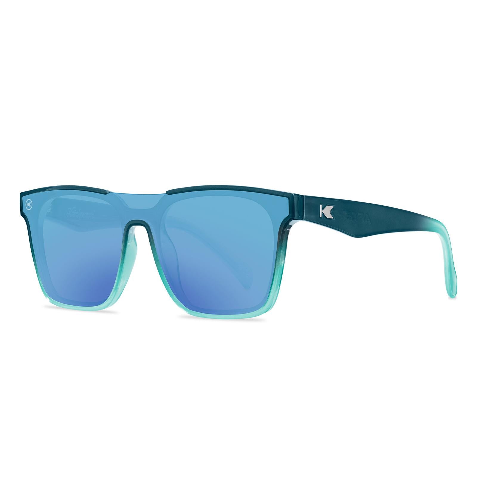 Sunglasses with a blue frame with polarized blue lenses, threequarter