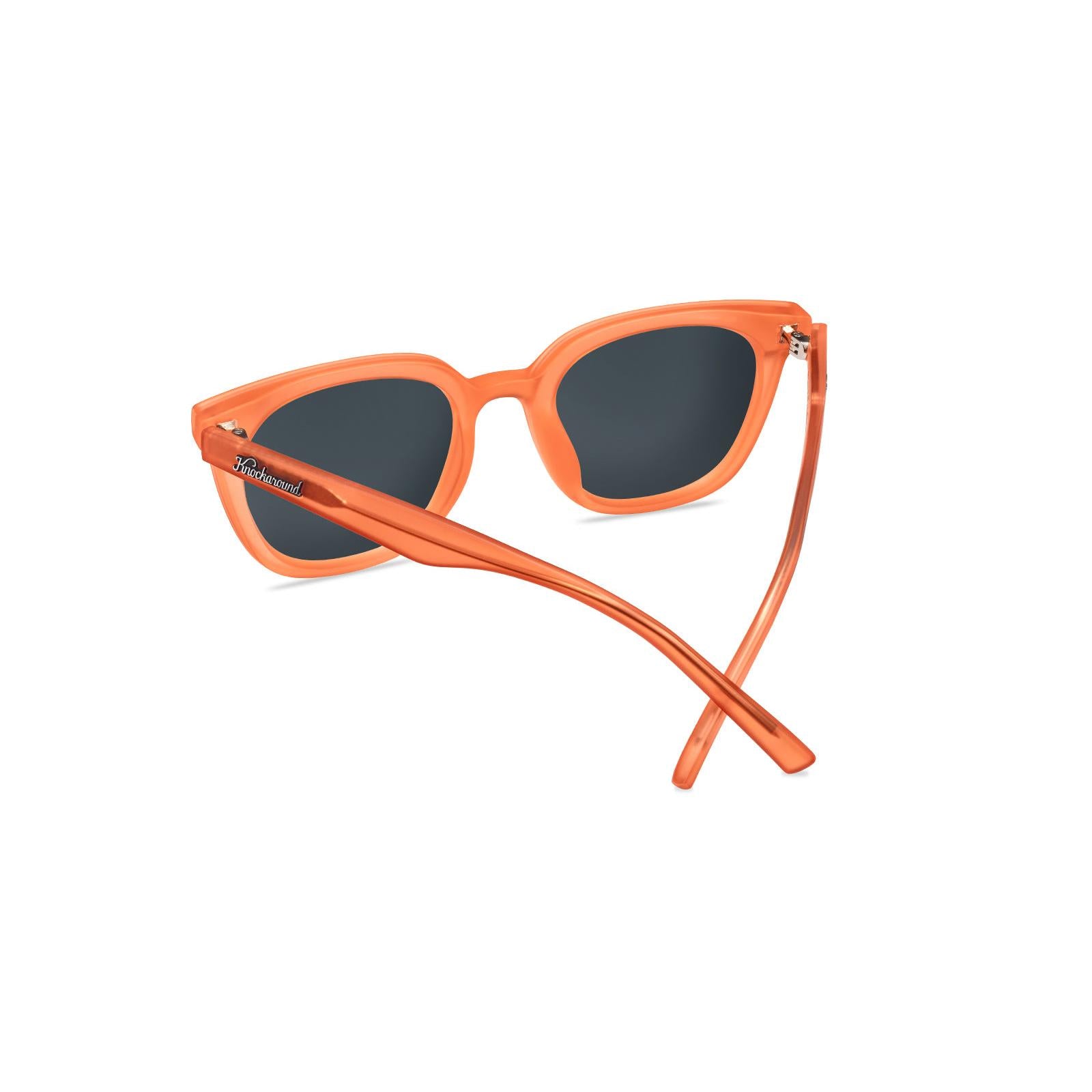 Sunglasses with an orange frame with polarized orange lenses, back