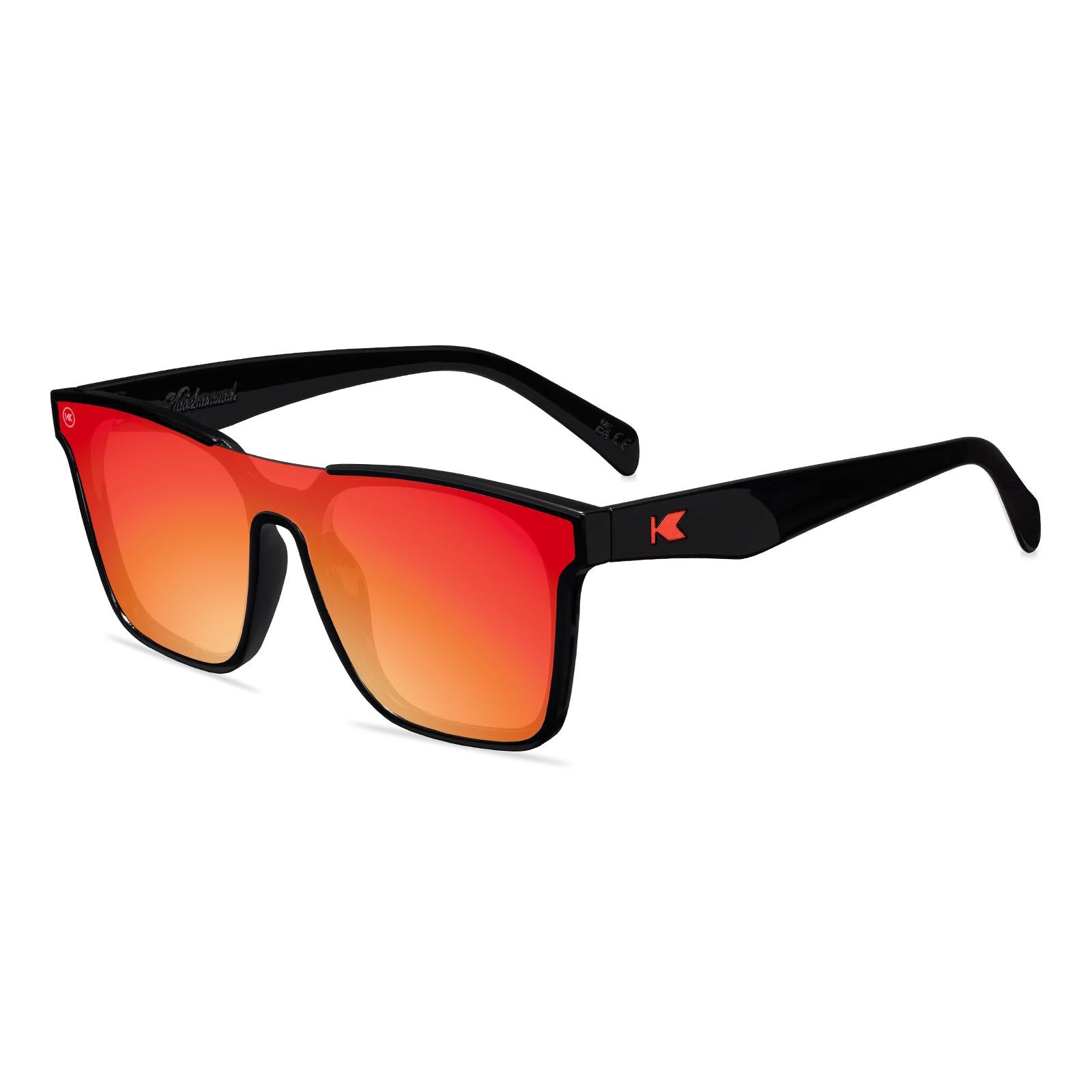 Sunglasses with a black frame with polarized orange lenses, flyover