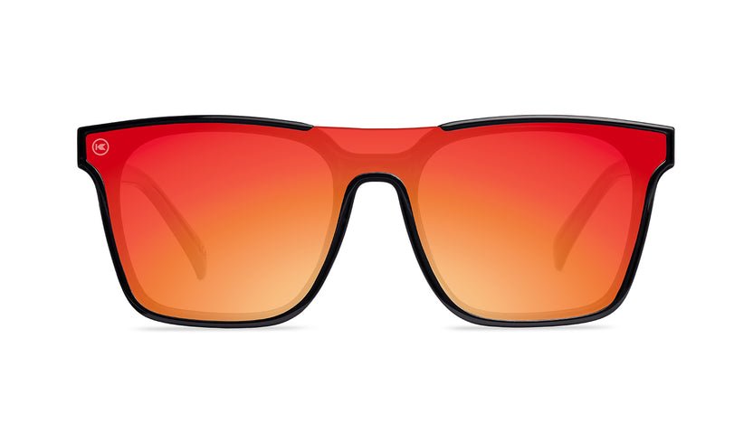 Sunglasses with a black frame with polarized orange lenses, front