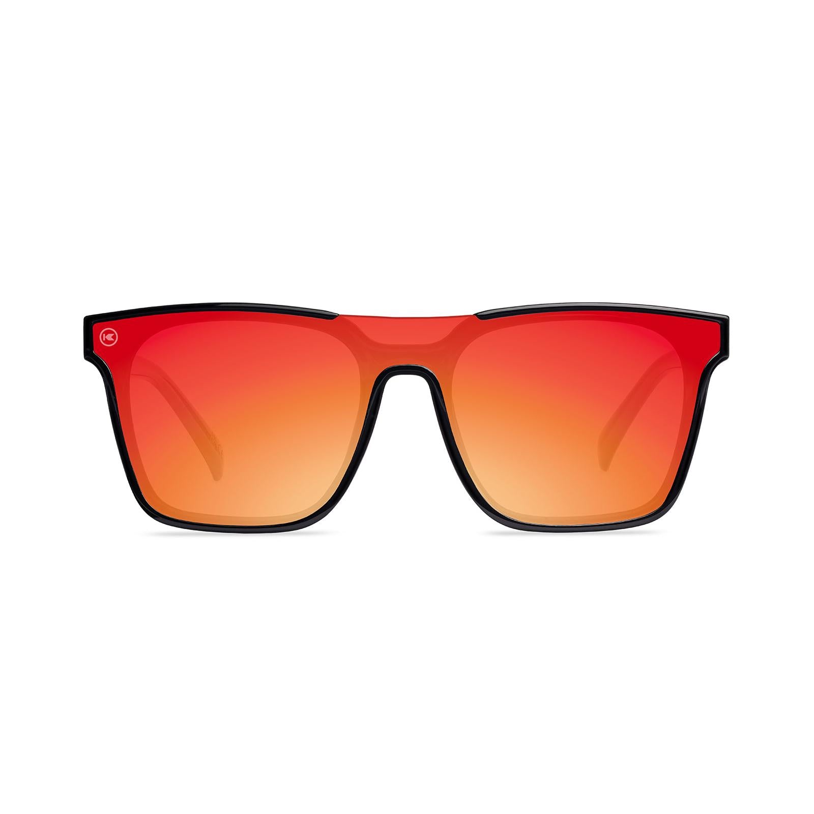 Sunglasses with a black frame with polarized orange lenses, front