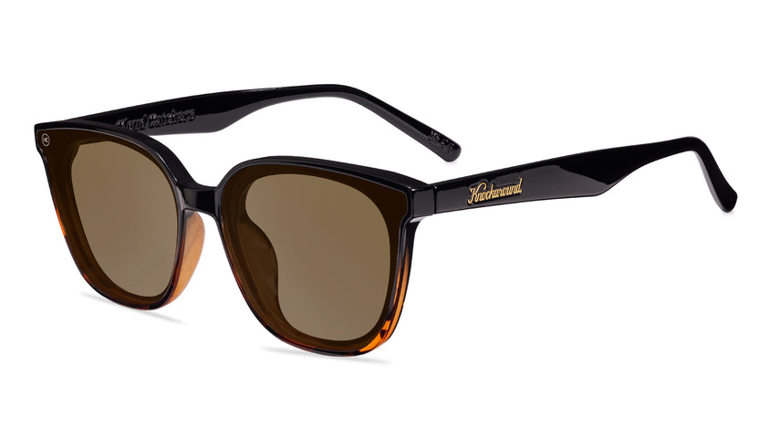 Sunglasses with a amber frame with polarized amber lenses, flyover