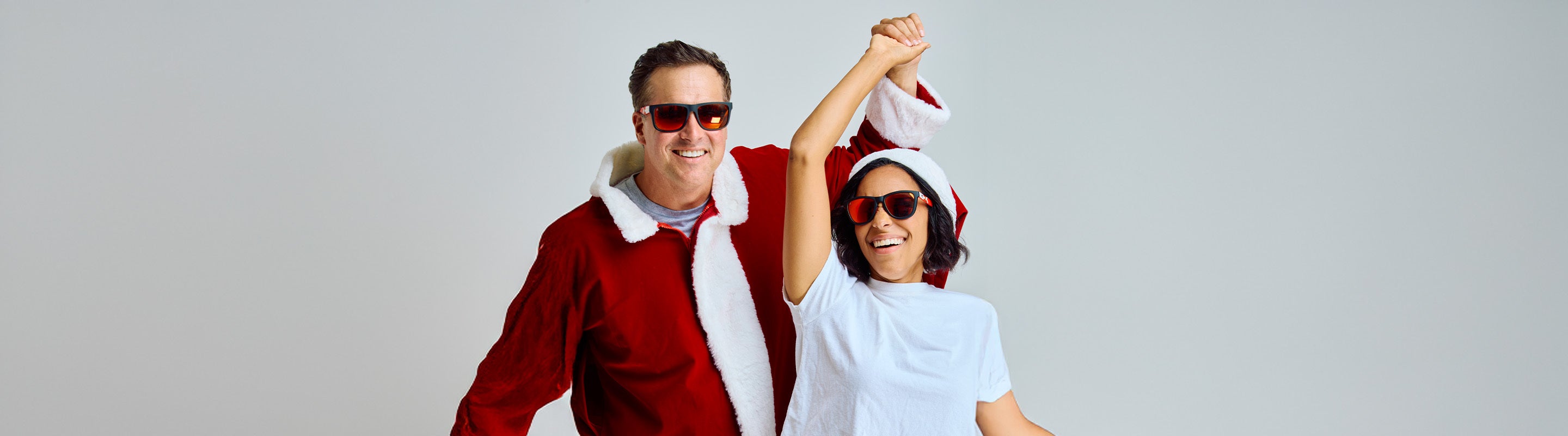 Best Sellers Collection Sunglasses. Men wearing Santa Clause Torrey Pines Sport and Women wearing Santa Claus Premiums Sport Sunglasses