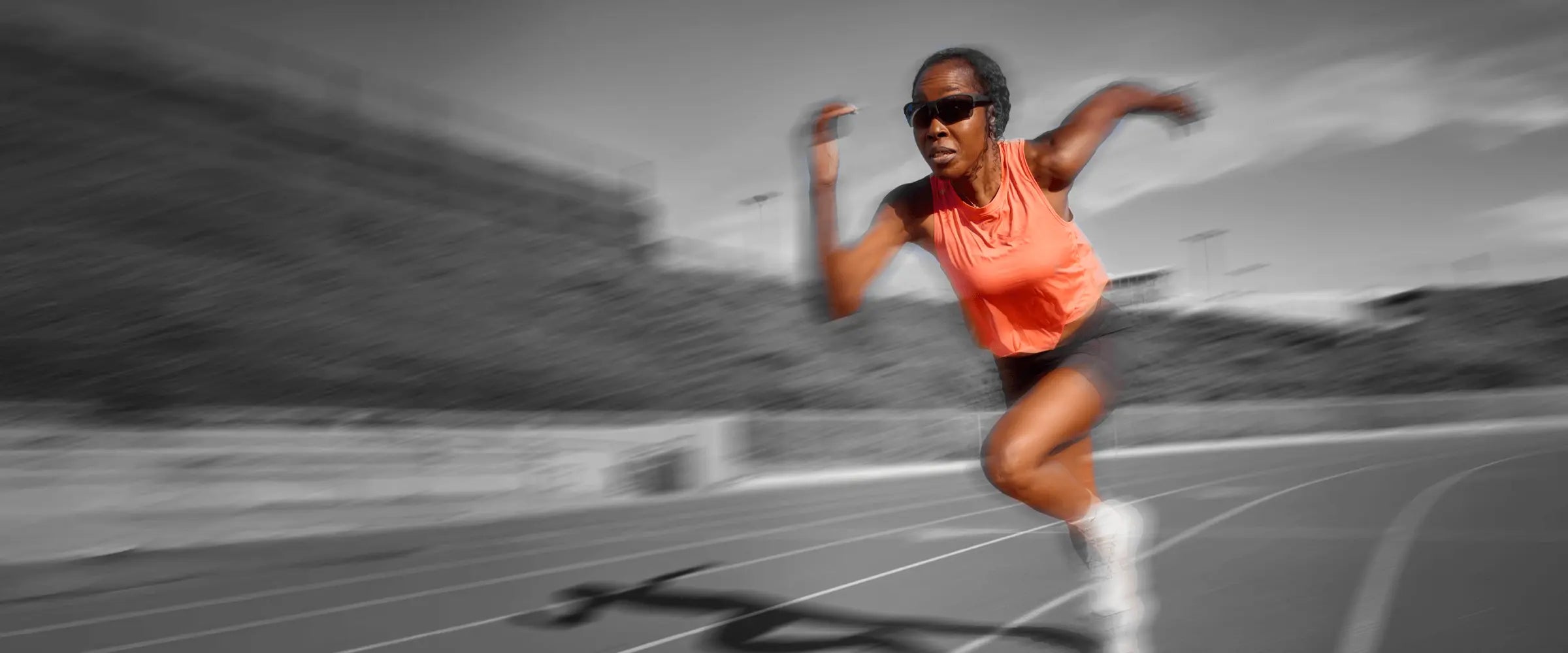 image of woman running and wearing Knockaround performance eyewear