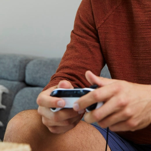 Male gamer wearing Knockaround Blue Light Blockers