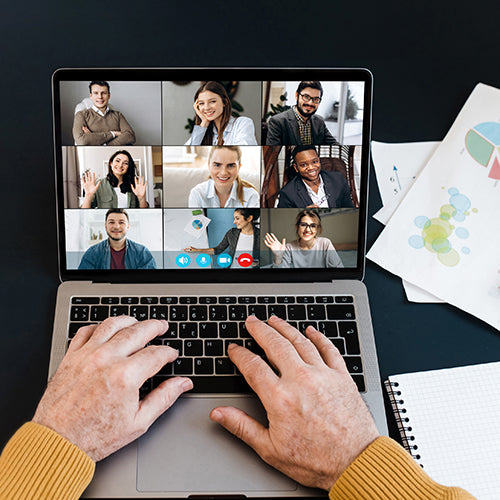 Top view of laptop screen with video conference participants