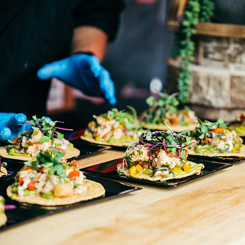 Person serving tacos