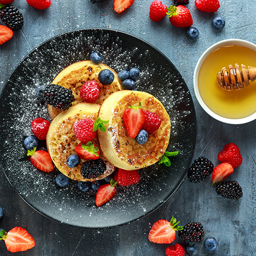 British crumpets with berries and honey