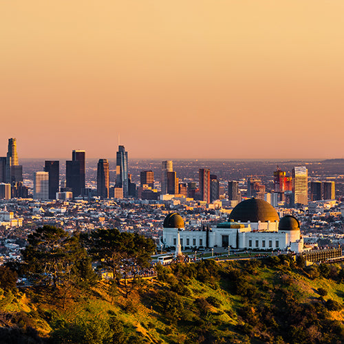 Los Angeles skyscrapers and Griffith Observatory at sunset