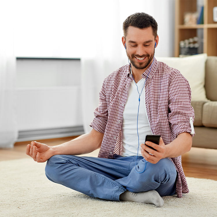 Man using phone app to meditate