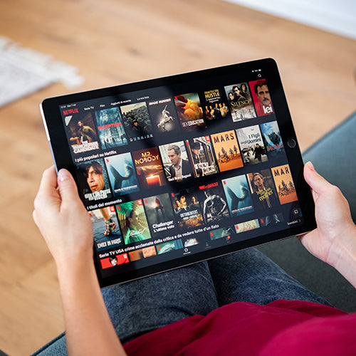 Woman watching Netflix on digital tablet