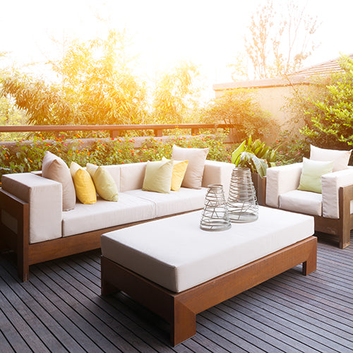 White outdoor furniture set on a patio