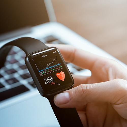 Close up of hand touching smartwatch with health app on the screen