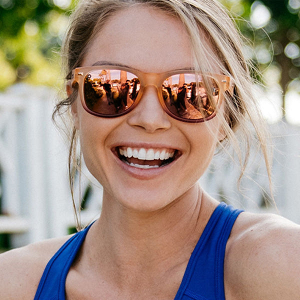 Woman wearing Knockaround Frosted Rose Quartz Fade Rose Fort Knocks Sunglasses