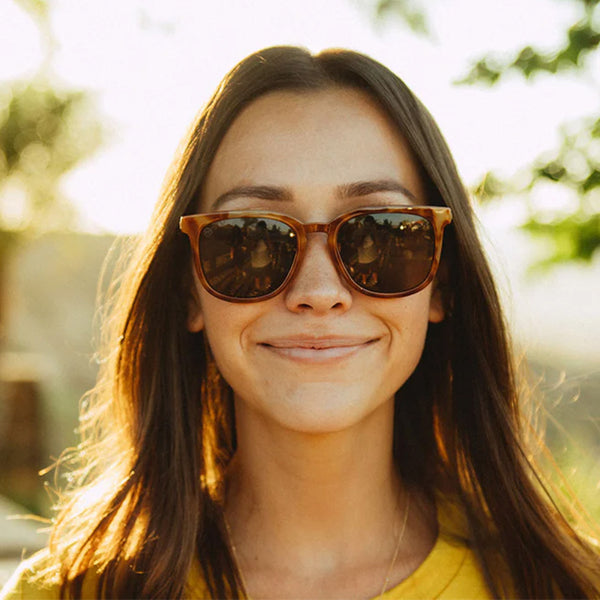 Woman wearing Knockaround Glossy Blonde Tortoise Shell Amber Sunglasses