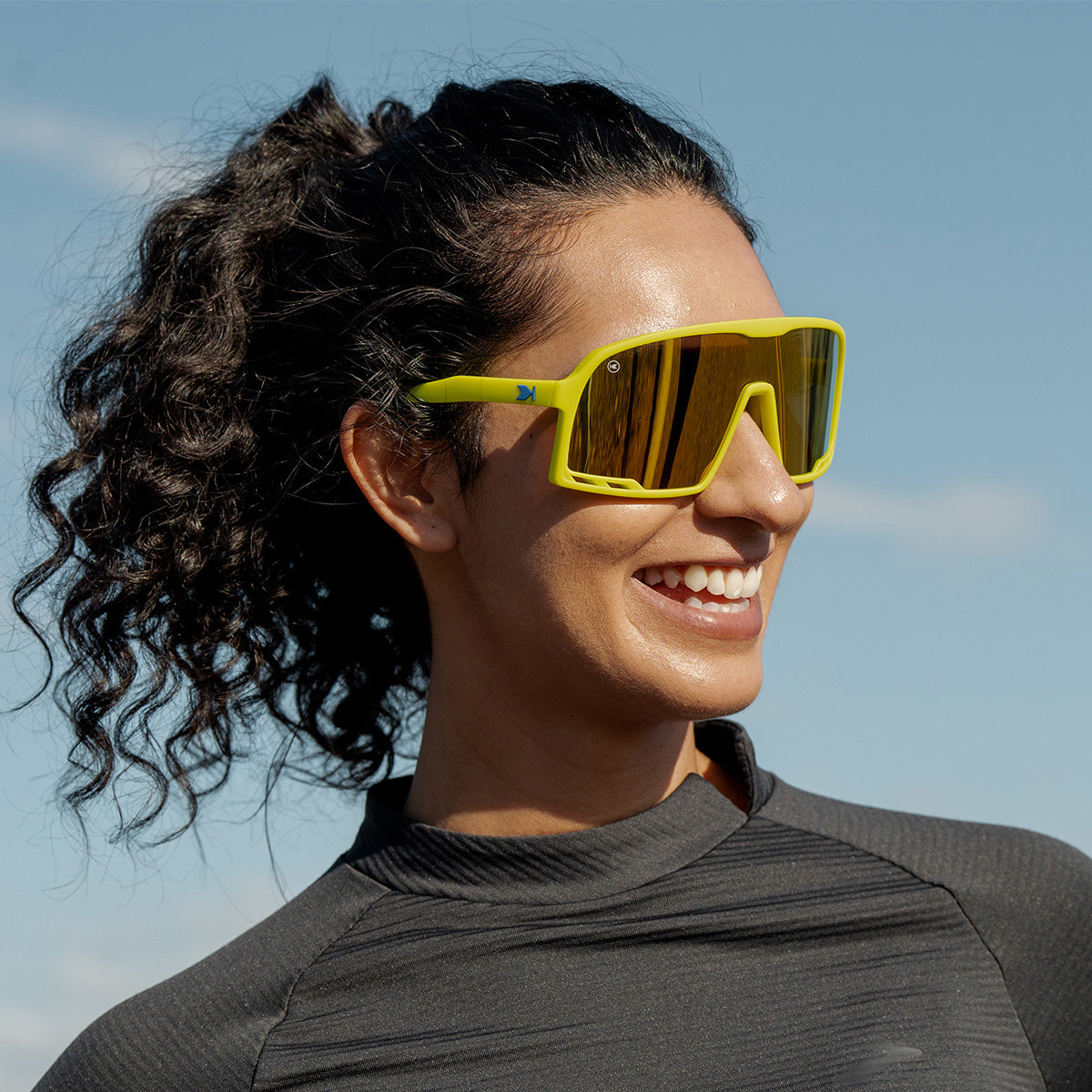 Woman wearing Knockaround High Voltage Campeones