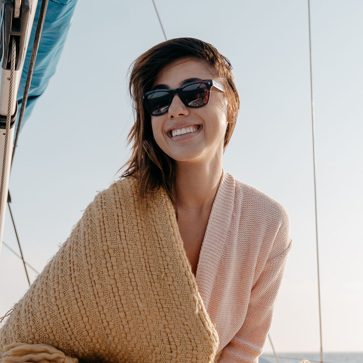 Woman wearing Knockaround Imperial Seventy Nines Sunglasses