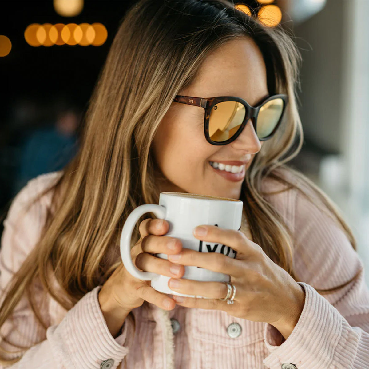 Woman wearing Knockaround Matte Tortoise Shell Rose Gold  Deja Views