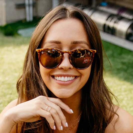 Woman wearing medium sunglasses