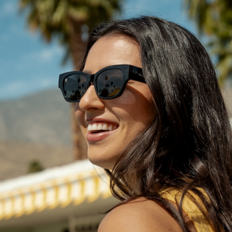 Women wearing Black on Black Junipers Sunglasses