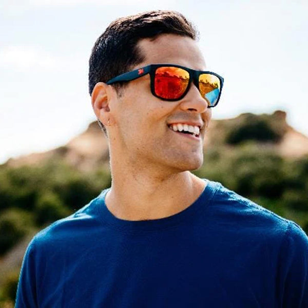 Man wearing Knockaround Matte Black Red Sunset Torrey Pines Sunglasses