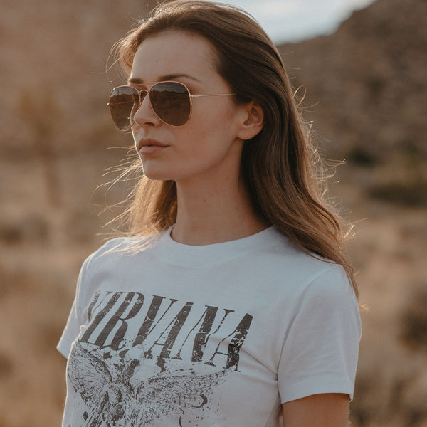 Woman wearing Knockaround Vegas Velour Mile Highs Sunglasses