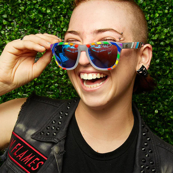 Woman wearing Knockaround Pride Premium Sunglasses