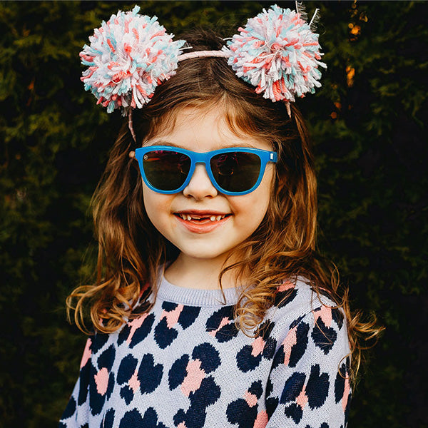 A girl kid wearing Knockaround Rainbow Blues Kids Premiums  Sunglasses