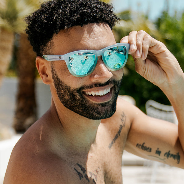 Man wearing Knockaround Tropi Lectric Premiums Sunglasses