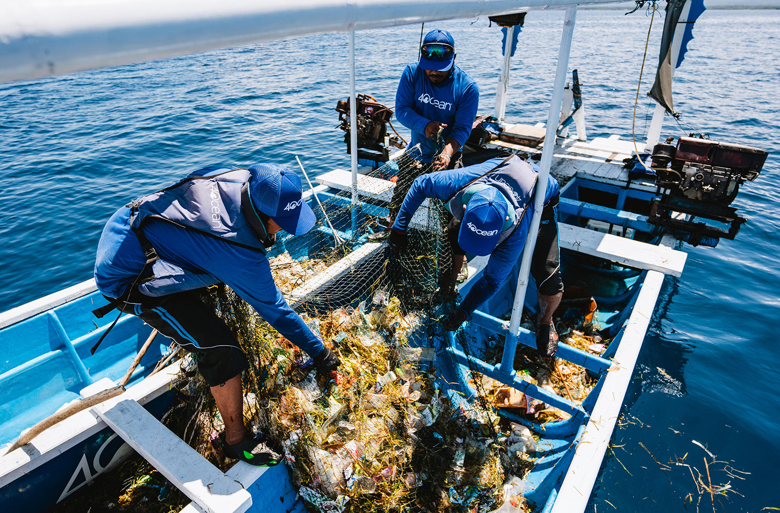 image of crew collecting plastic from ocean