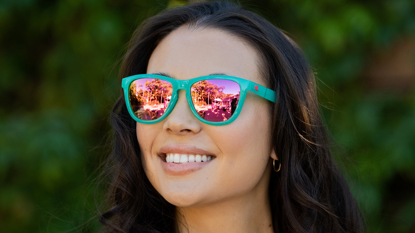 Women wearing Aquamarine / Fuchsia Premiums Sport Sunglasses