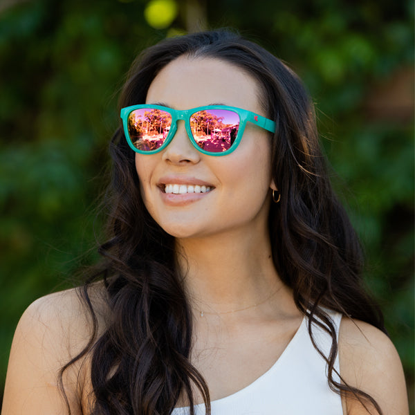 Women wearing Aquamarine / Fuchsia Premiums Sport Sunglasses