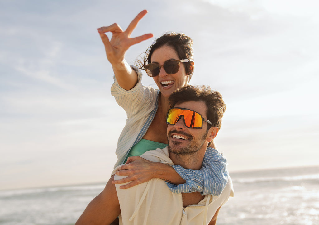 Woman wearing Rio Cloudcatchers and man wearing Magma Campeones sunglasses at the beach