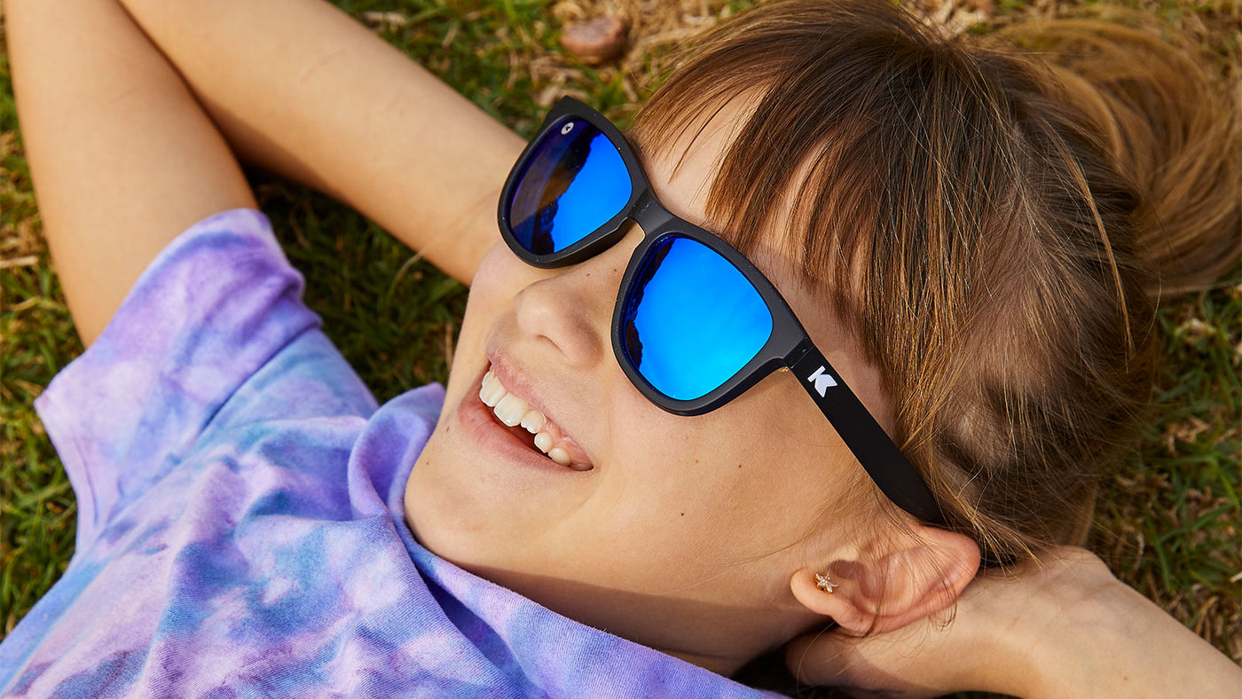 A kid girl wearing sunglasses