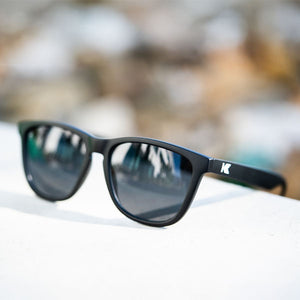 Lifestyle photo of Black / Smoke Classics Sunglasses