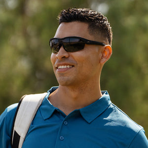 Man wearing Black on Black Kinetics Sunglasses