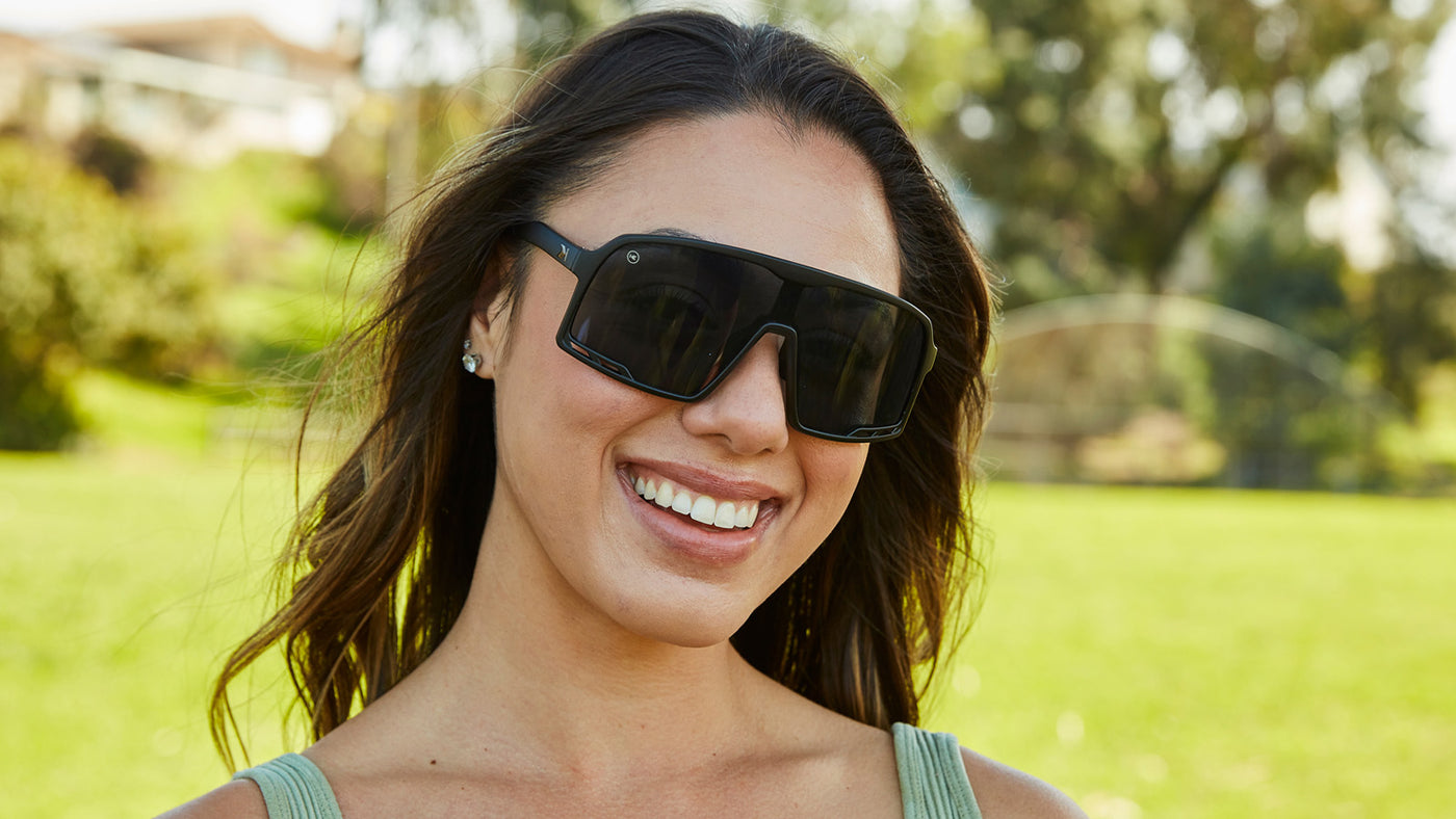 Sport Sunglasses with Black Frames and Black Smoke Lenses, Female Model