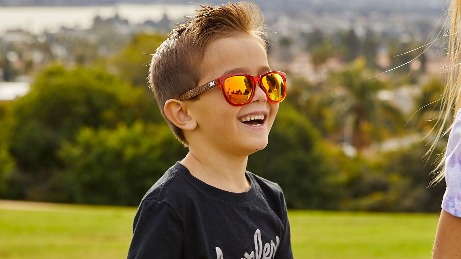 A boy kid wearing sunglasses