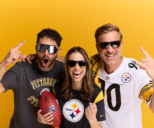 Three sports fans wearing Steelers sunglasses