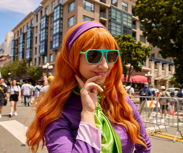 Woman wearing Scooby-Doo Pacific Palisades sunglasses dressed up as Daphne from the cast of Scooby-Doo