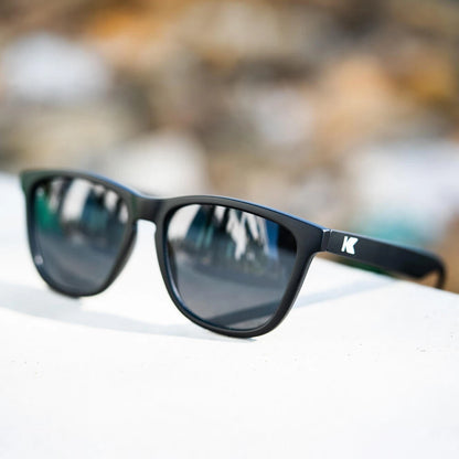 Lifestyle photo of Black / Smoke Classics Sunglasses