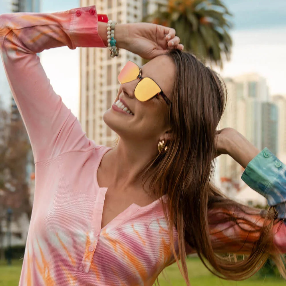 Woman wearing Hot Take Cloud Catchers sunglasses