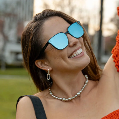 Woman wearing Night Swim Cloud Catchers sunglasses