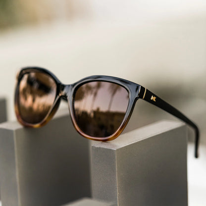Lifestyle photo of Glossy Black & Blonde Tortoise Shell Fade Deja Views Sunglasses